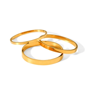Three-piece set of polished gold plated stainless steel bangles for a minimalist look