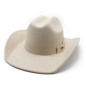 Detailed close-up of a cream wool felt cowboy hat with a satin bow and wide brim