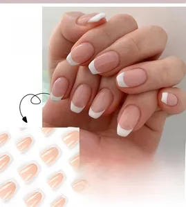 Detail of short ballet French press-on nails with nude pink base and white tips