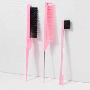 Detailed view of 3-piece pink hairstyling brush set with steel pin tail and edge control comb