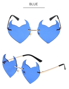 Close-up of blue devil heart frameless sunglasses with gold metal frame and slim temples