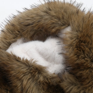 Detailed macro view of plush faux fur lining and thick winter hat earflap material