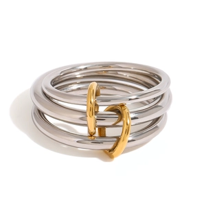 Polished stainless steel stacked rings with silver bands and gold linking connectors