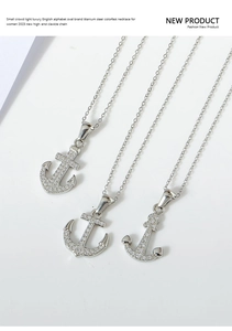 Macro view of anchor pendant necklace with micro-pave cubic zirconia in titanium steel