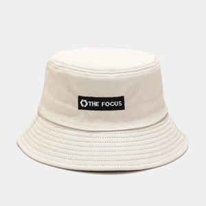 Fashionable beige cotton bucket hat with black embroidered THE FOCUS logo for unisex street style
