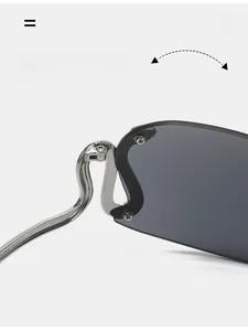 Detail of durable S-shaped silver metal hinge and gray rimless lens on Y2K sunglasses