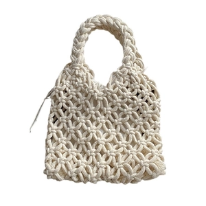 Handmade cream white woven cotton rope handbag featuring bohemian French style on plain white