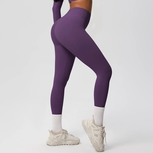 Detail view of high-waist seamless purple yoga pants with body-sculpting fit and elastic fabric