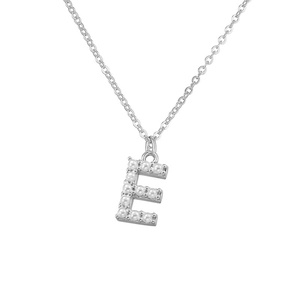 Macro detail of silver necklace featuring an elegant letter E pendant with white pearls