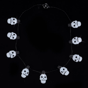 Macro view of 10-piece skull LED string lights with clear beads and black wires