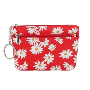 Red daisy print mini coin purse with textured fabric, metal zipper, and keychain hook