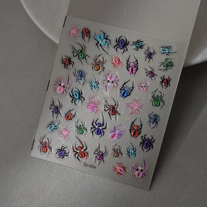 Macro shot of 3D colorful spider nail art stickers with glitter and metallic finish