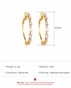Detailed spec sheet of gold alloy hoop earrings featuring marquise cubic zirconia stones