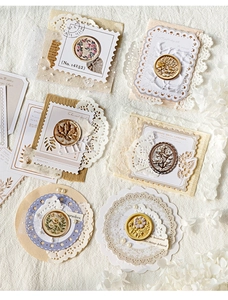Detailed close-up of vintage 3D relief wax seal stickers with metallic gold and purple tones