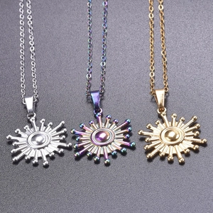 Three sunburst pendant necklaces in gold, silver, and rainbow finishes on dark background