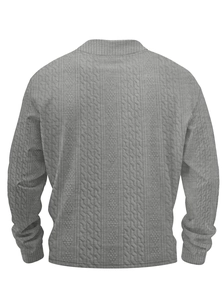 Detailed back view of grey turtleneck sweater featuring intricate vertical cable knit texture