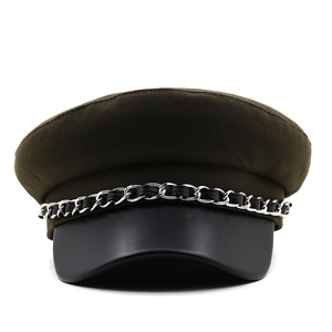 Close-up of olive green flat top hat with black leather brim and silver metal chain strap