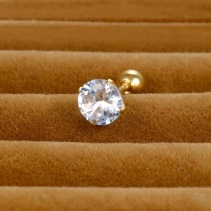 Macro detail of gold-plated round zircon stud earring with ball screw back on velvet