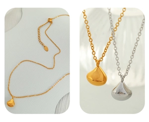 Detailed close-up showing gold and silver teardrop pendant necklaces with fine chains