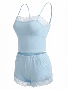 Detail of light blue lace lingerie set showing delicate stitching and soft fabric texture