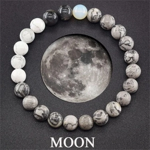 Detail of Moon themed natural stone bead bracelet with solar system planet style beads