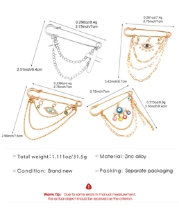 Detailed view of punk chain brooches with cross, heart, and star pendants in zinc alloy