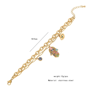 Detail of 18+5cm stainless steel gold double-layer bracelet with Hamsa Hand and Evil Eye charms