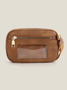 Detail of dark brown leather card holder featuring transparent window and gold zipper hardware