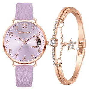 Detail view of pink quartz watch with moon dial and rose gold rhinestone star bracelet