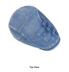 Top view of light blue denim beret featuring unique pocket detail and Chinese frog buttons