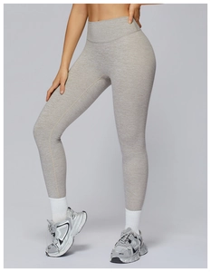Close-up of high-waist heather grey yoga pants showing fabric texture and sleek fit