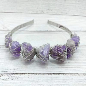 Natural amethyst and white crystal crown headband with silver wire wrap on white wood background