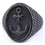 Detail of matte black stainless steel ring with embossed anchor design and honeycomb texture