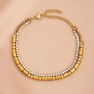 Detail view of double-layer gold Morse code bracelet with rhinestones and extension chain