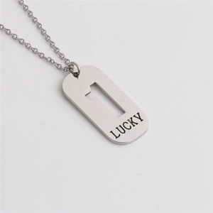 Detail of silver titanium steel pendant featuring cutout number one and lucky engraving