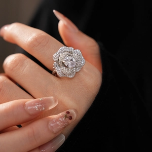 Close-up of sparkling flower ring with oval cubic zirconia on a model hand