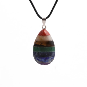 Rainbow chakra crystal necklace with teardrop resin pendant on black cord