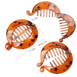 Detailed view of amber tortoise shell banana hair clips in 5.3cm and 6.3cm sizes