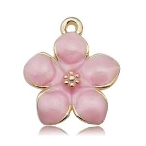Detailed macro shot of a pink enamel cherry blossom pendant with golden metal edges