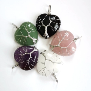 Detailed wire-wrapped Tree of Life design on diverse heart-shaped natural stone pendants