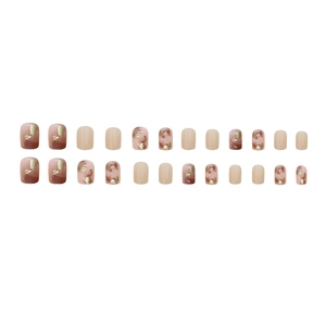Short round press-on nails set with red marble gradient and gold glitter accents