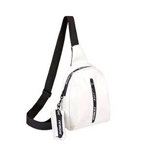 White minimalist crossbody chest bag with adjustable strap and small pendant accessory