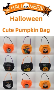Close-up of plush Halloween candy bags with pumpkin and ghost embroidery details