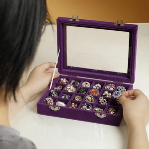 Purple velvet jewelry box with 24 slots, glass lid and metal clasp for rings