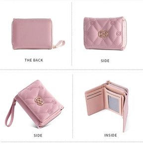 Detail of pink embroidered wallet showing back, side views, and internal card slots