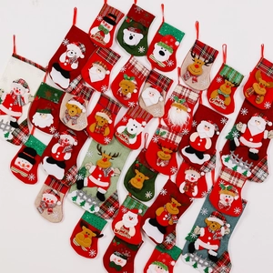 Classic embroidered Christmas stockings featuring Santa, Snowman and Reindeer characters