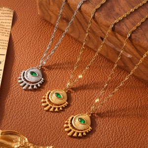 Gold and silver evil eye necklaces with green zircon pendant on a rope chain