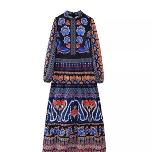 Elegant stand collar floral long sleeve maxi dress featuring vibrant patterns on dark fabric