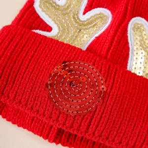 Red knit Christmas hat for kids featuring sparkling sequin reindeer antlers design
