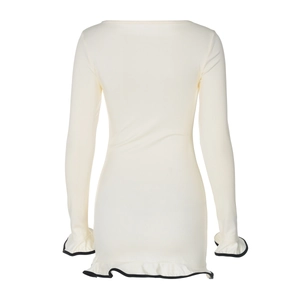 Detail of cream long sleeve mini dress with black contrast ruffled edges and smooth texture